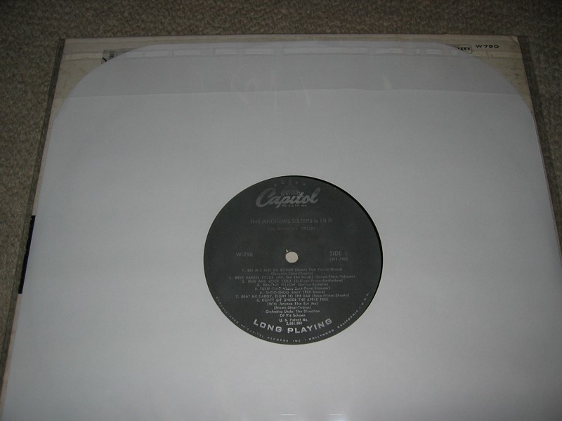 [Jacket and LP Disc stored in resealable poly sleeve]